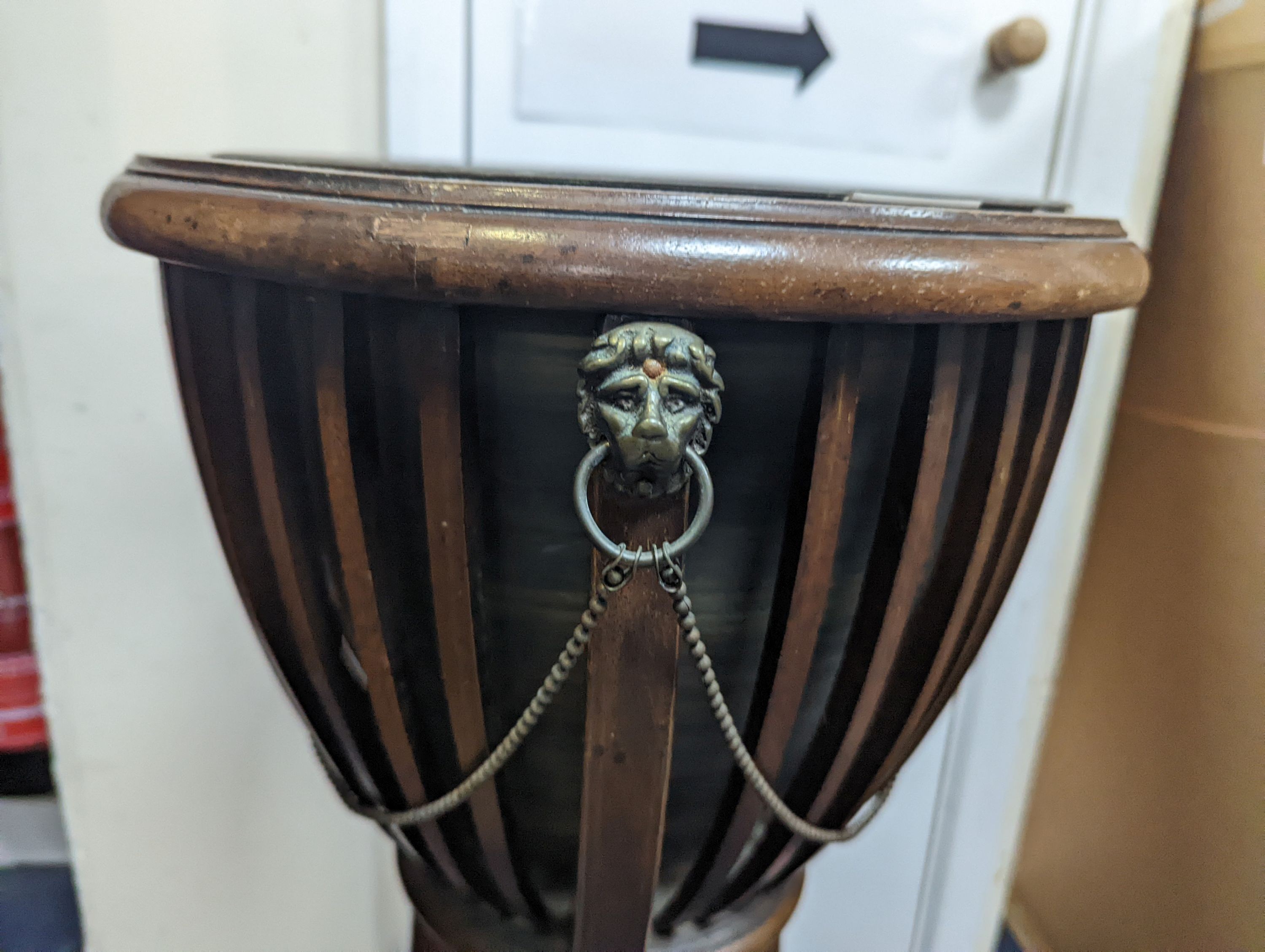 An Edwardian style inlaid mahogany jardiniere with brass liner, diameter 35cm, height 85cm